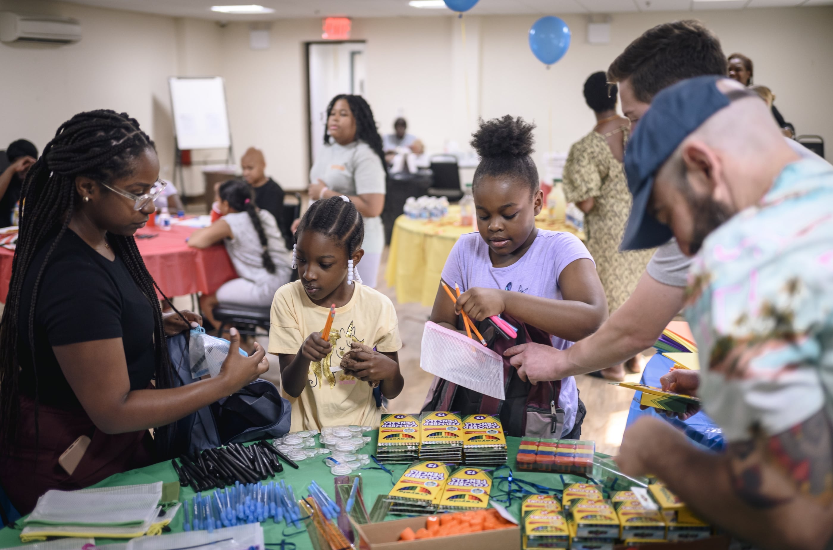 Belveron Donates and Distributes Backpacks and School Supplies in Harlem